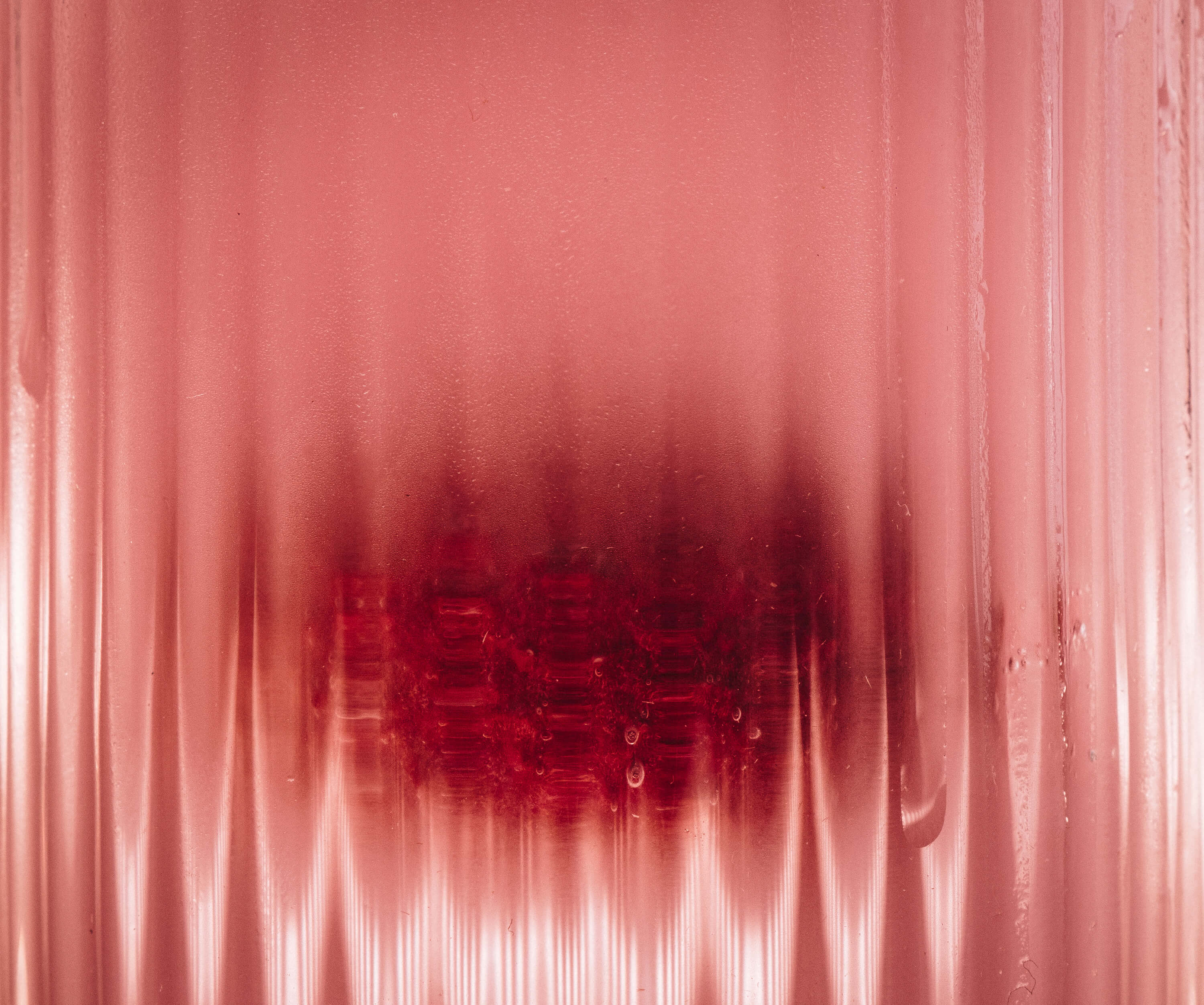 Abstract red and white pattern on a textured background